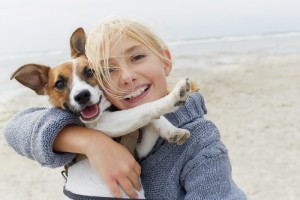  As per this study a canine brain’s reward centers get activated upon listening to happy & high-pitched voices. The reaction is positive to people linked with such sounds. Dogs are welcoming towards such people. Humans who sounded angry or had a deep voice were either ignored by canines or received negative reactions from them in the experiment. Image - people.com
